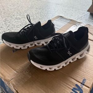 On Running Black Athletic Shoes with White Soles